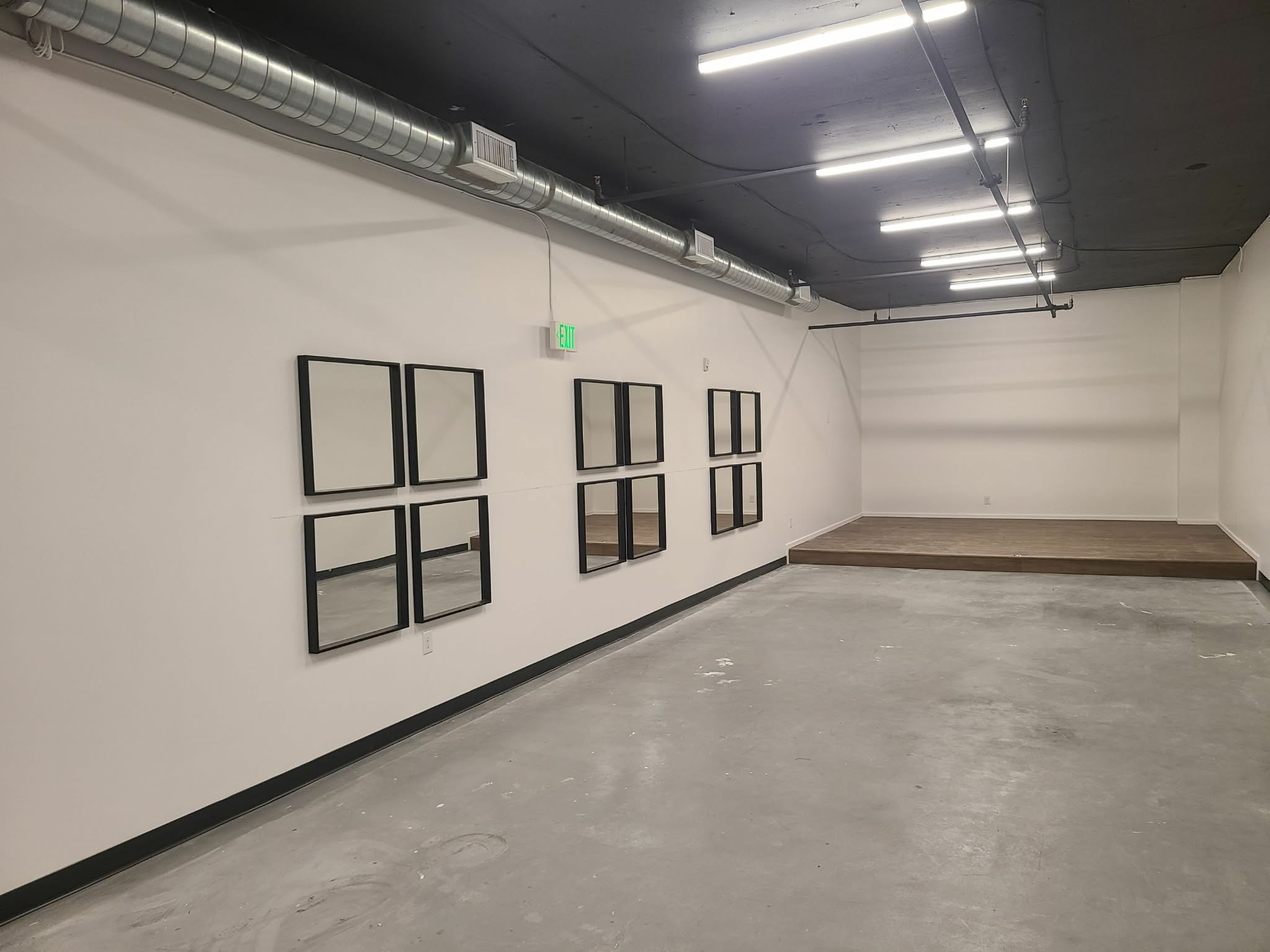 Commercial interior with white walls, black ceiling, and finished trim