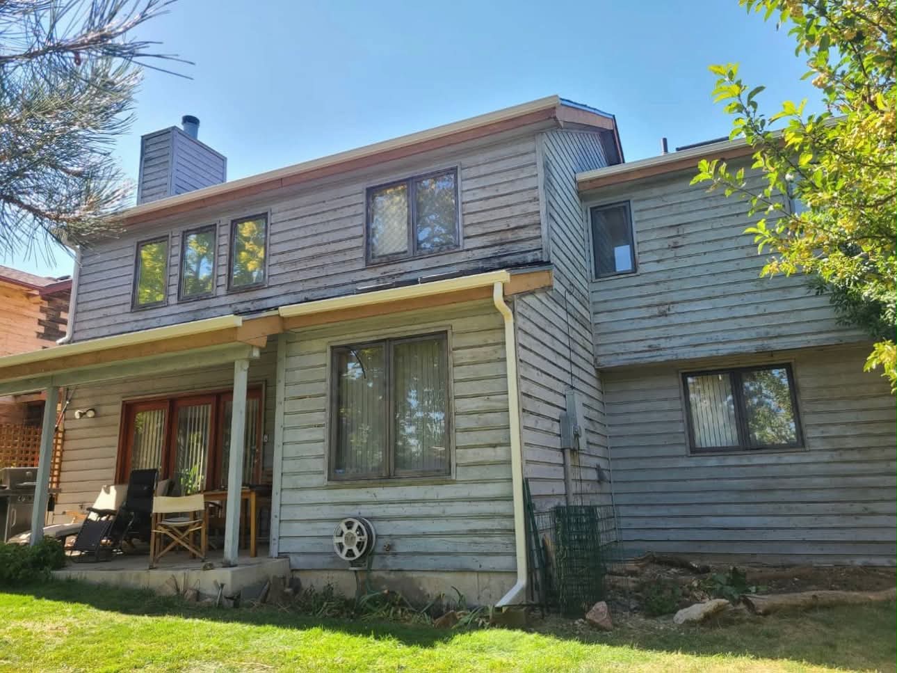 Weathered residential siding before exterior painting