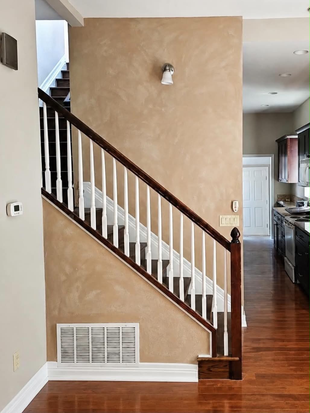 Interior staircase walls after a warm decorative paint finish