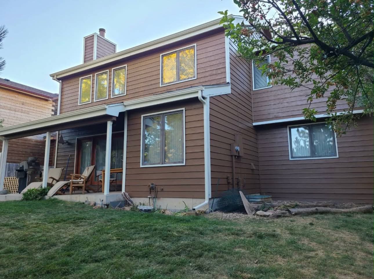 Residential siding restored with a rich brown exterior finish